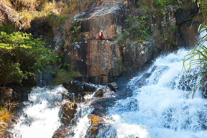 Rope climbing over Datanla waterfall. Photo: Ha Quang Trung